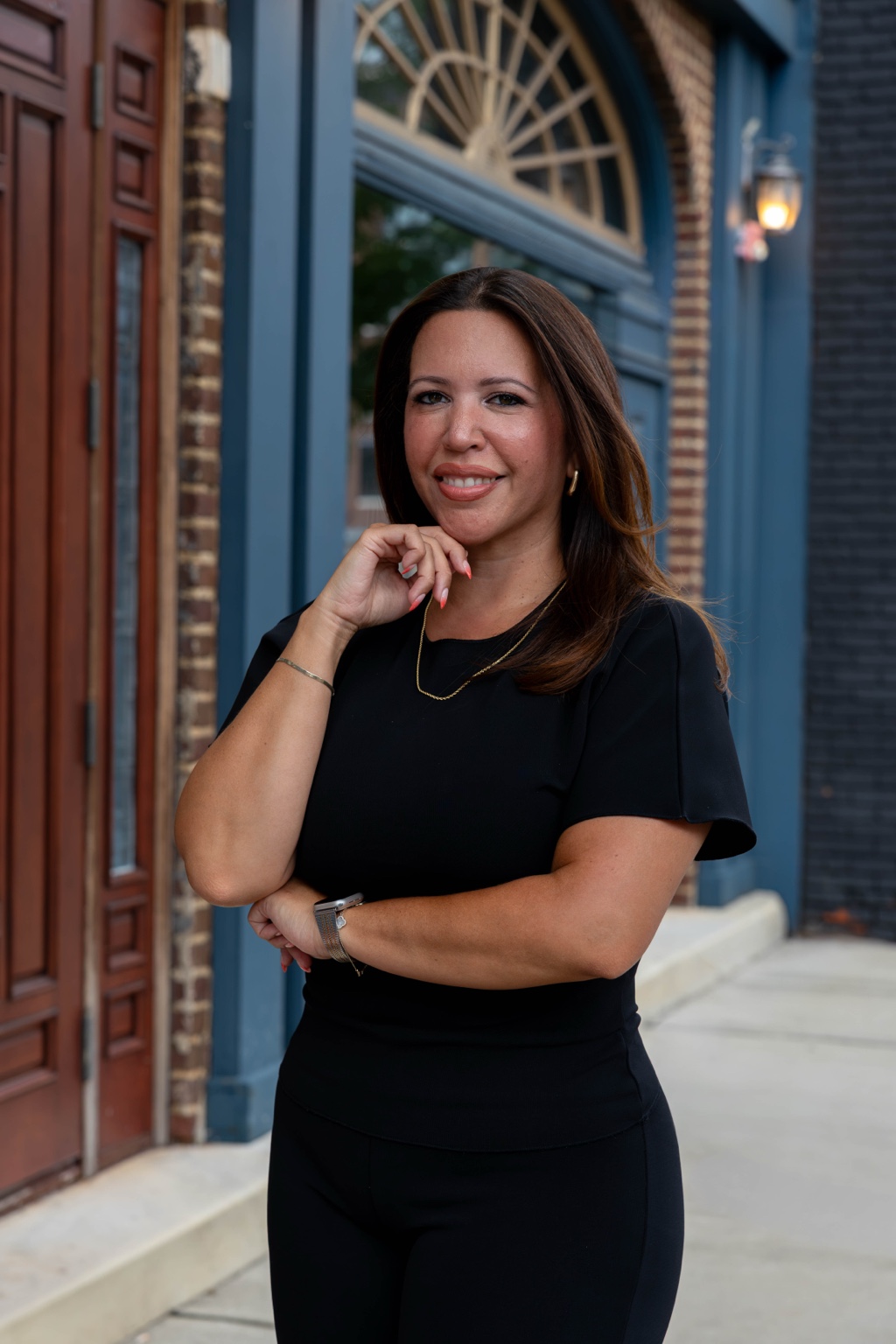 Johanna Estrada beside a blue doorway